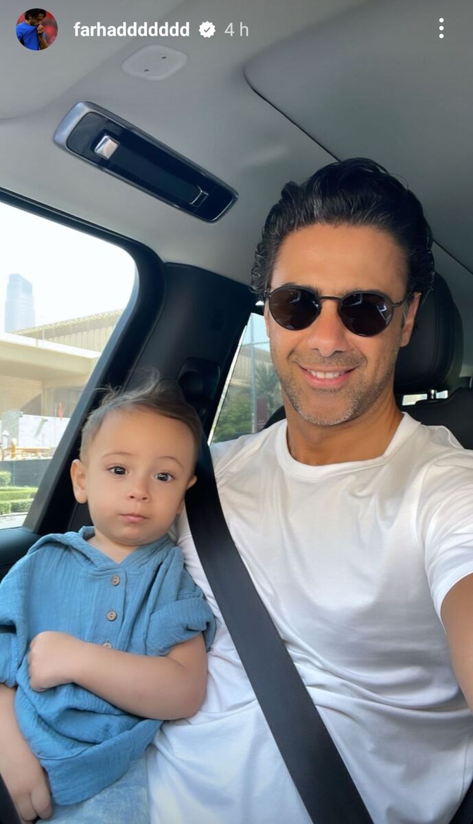 عکس| پسر بامزه در آغوش فرهاد مجیدی کیست؟