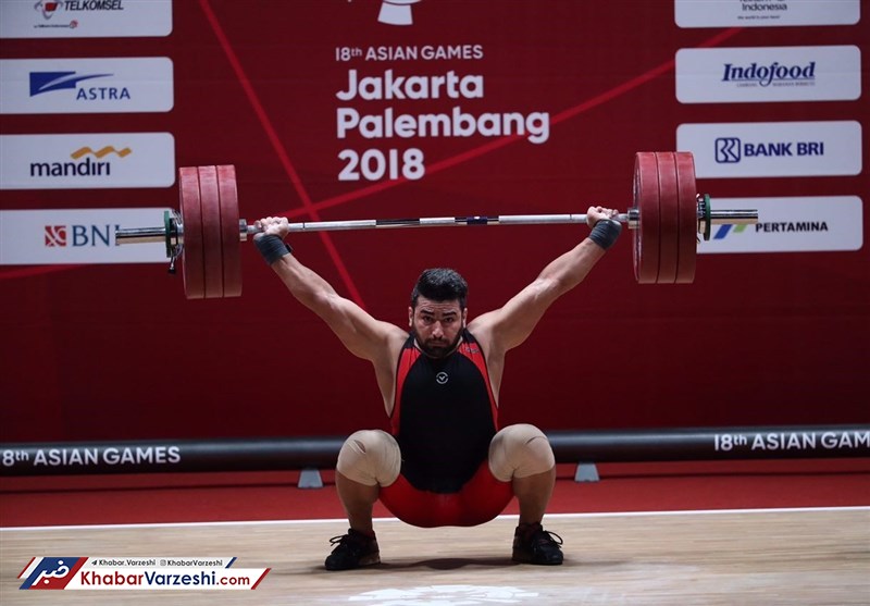 مدال طلای وزنه برداری قهرمانی جهان بر گردن علی هاشمی